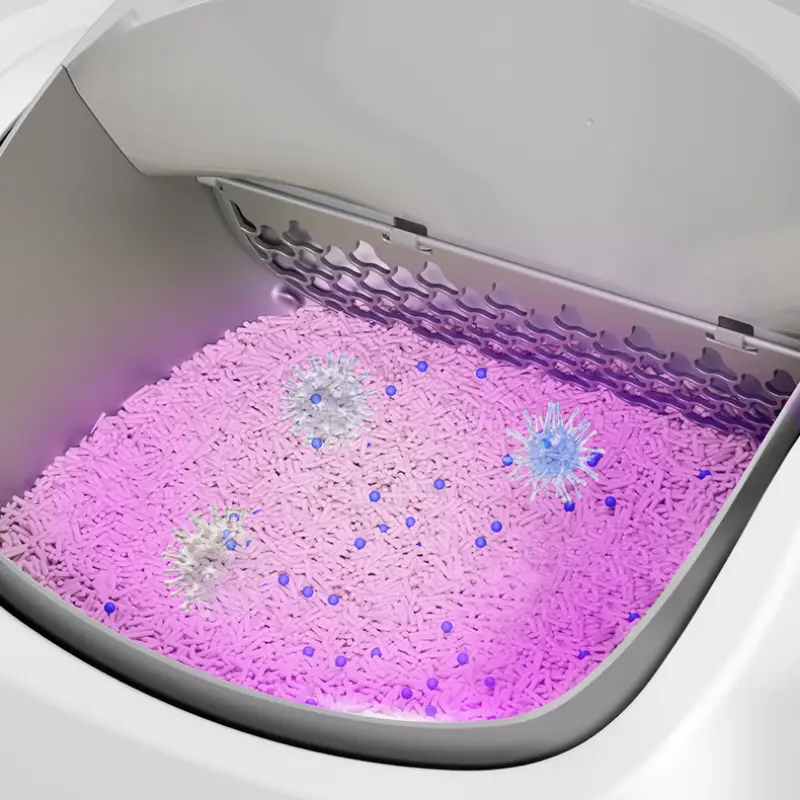 Close-up of smart self-clean cat litter box with UV sterilization light eradicating bacteria in the litter chamber