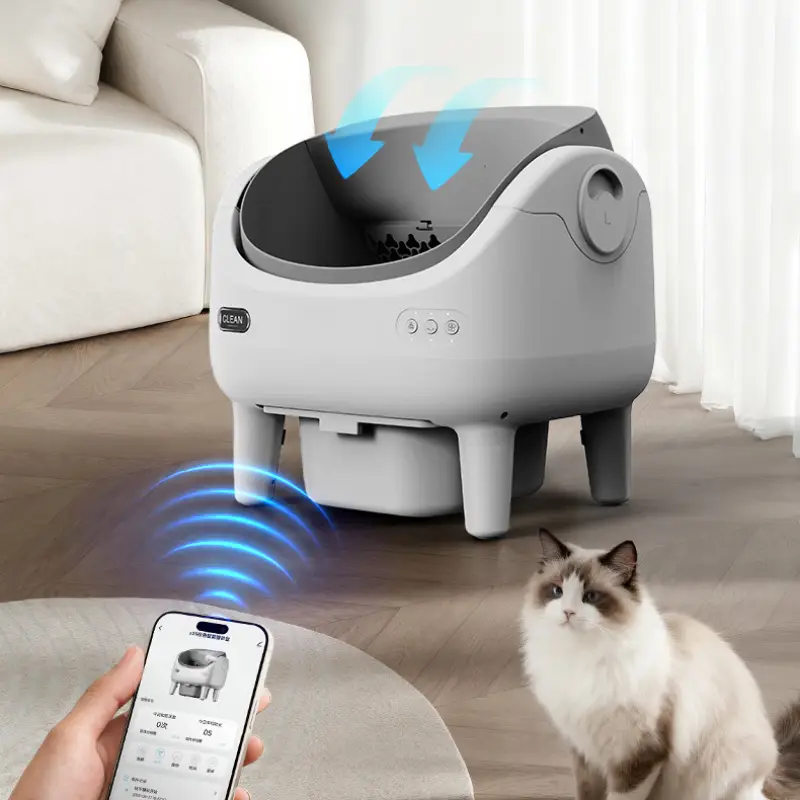 A smart self-clean cat litter box with APP remote control, smart air circulation & sensors, a cat nearby in a modern home
