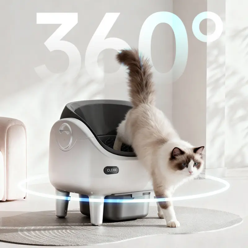 Ragdoll cat stepping out of a 360° open smart self-clean cat litter box in a bright modern pet home