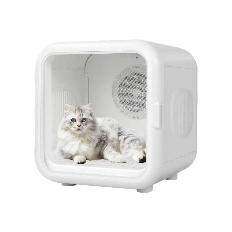 White pet drying box with a fluffy cat resting inside on a plain background.
