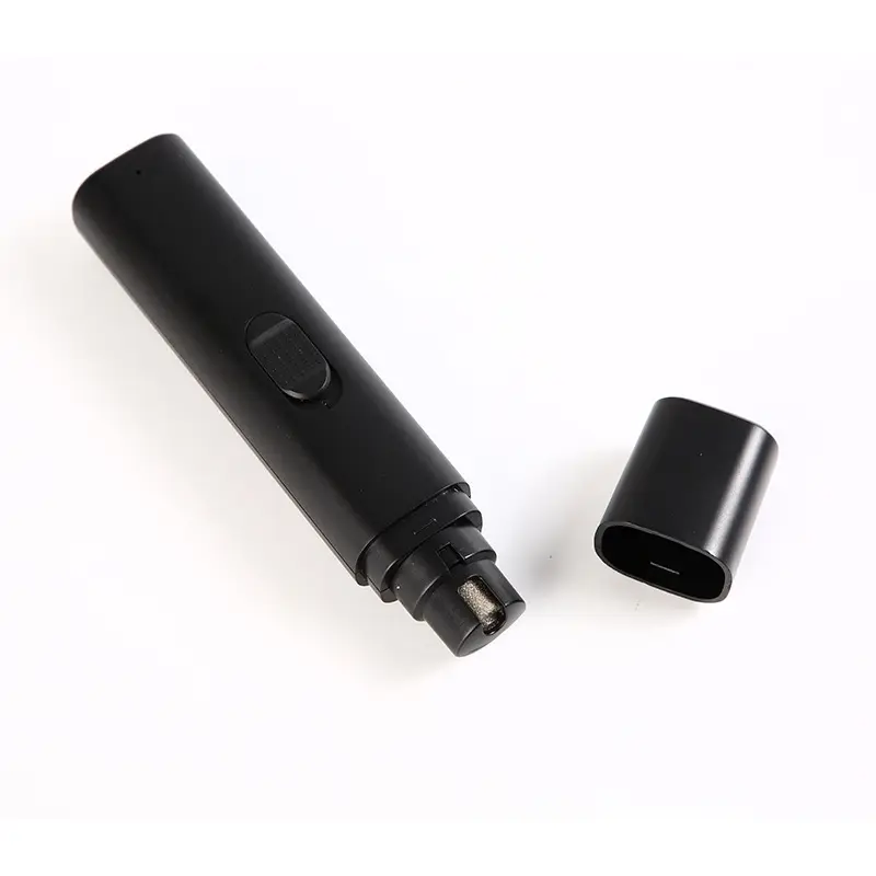Black electric pet nail grinder with detached protective cap and grinding head.