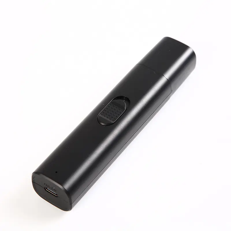 Black electric pet nail grinder with USB-C charging port on white background.