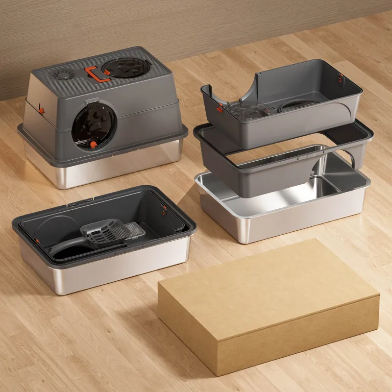 Assorted stainless steel cat litter box models on wood floor, with accessories and shipping box